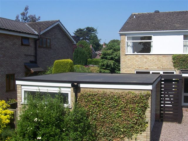 Flat roof Home in Sandbach with firestone rubbercover roofing on a garage.