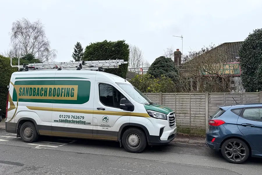 One of the Sandbach Roofing team\s van parked at a roofing job in Sandbach